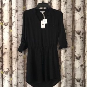 Anything but basic drawstring black dress.